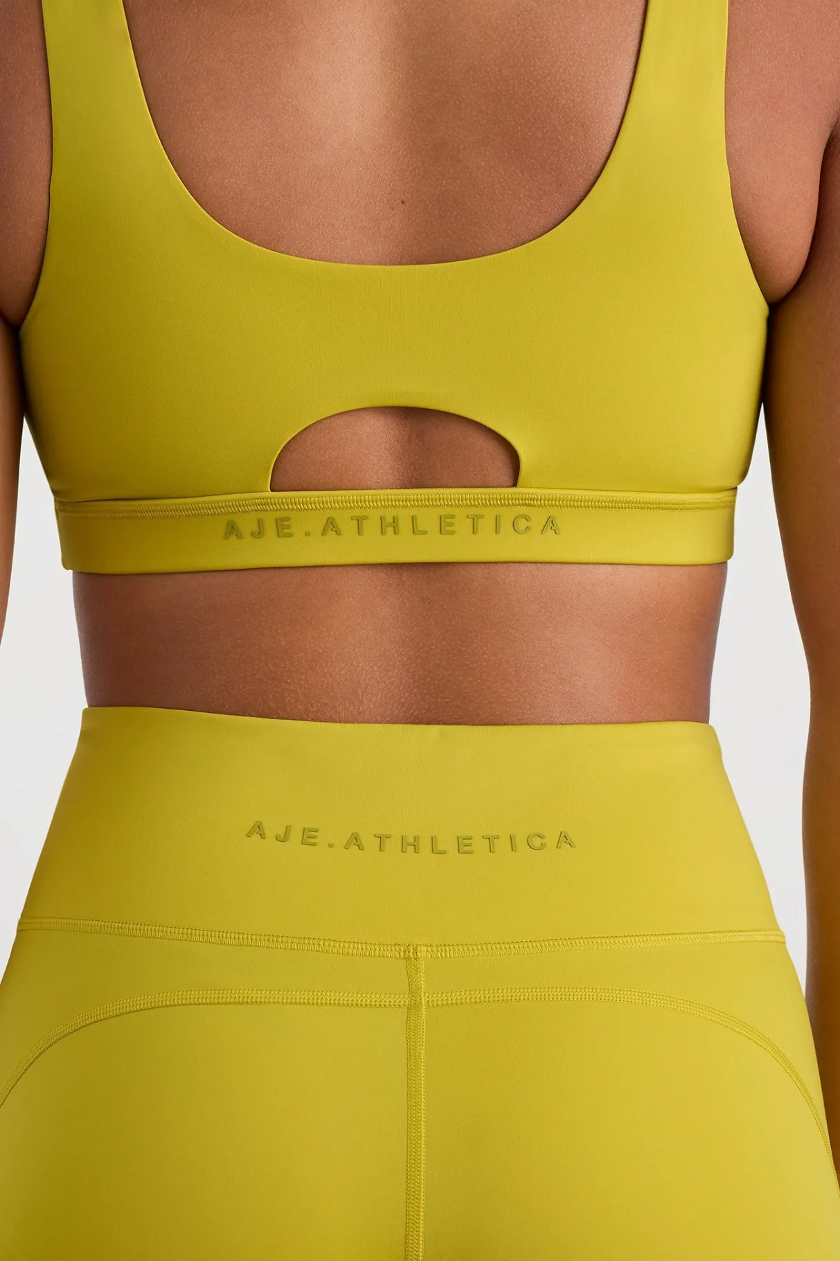 plunge_sports_bra__8.webp Shop Aje ATHLETICA Plunge Sports Bra 337 Solar Blaze