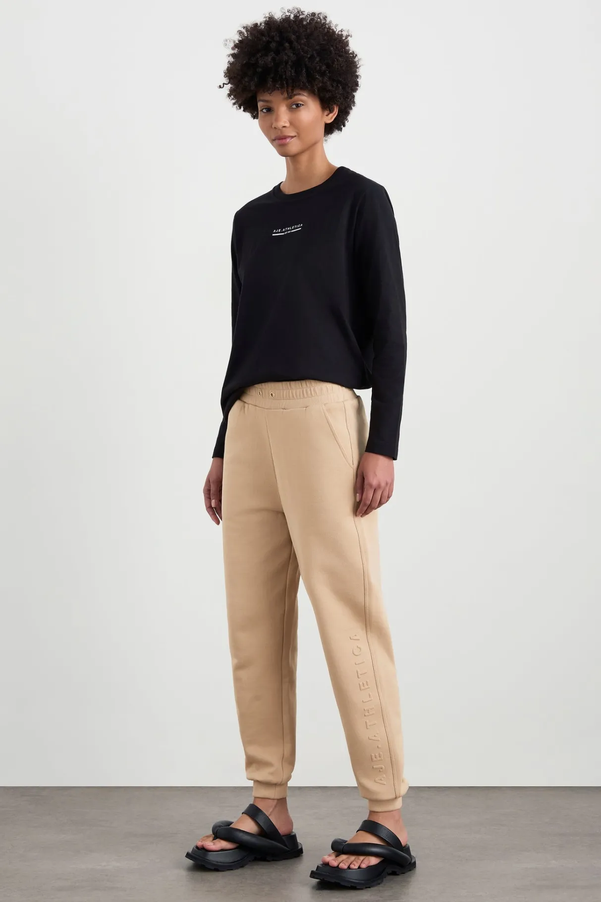 relaxed_track_pants__0.webp Fashion Aje ATHLETICA Relaxed Track Pants 508 Biscotti Beige