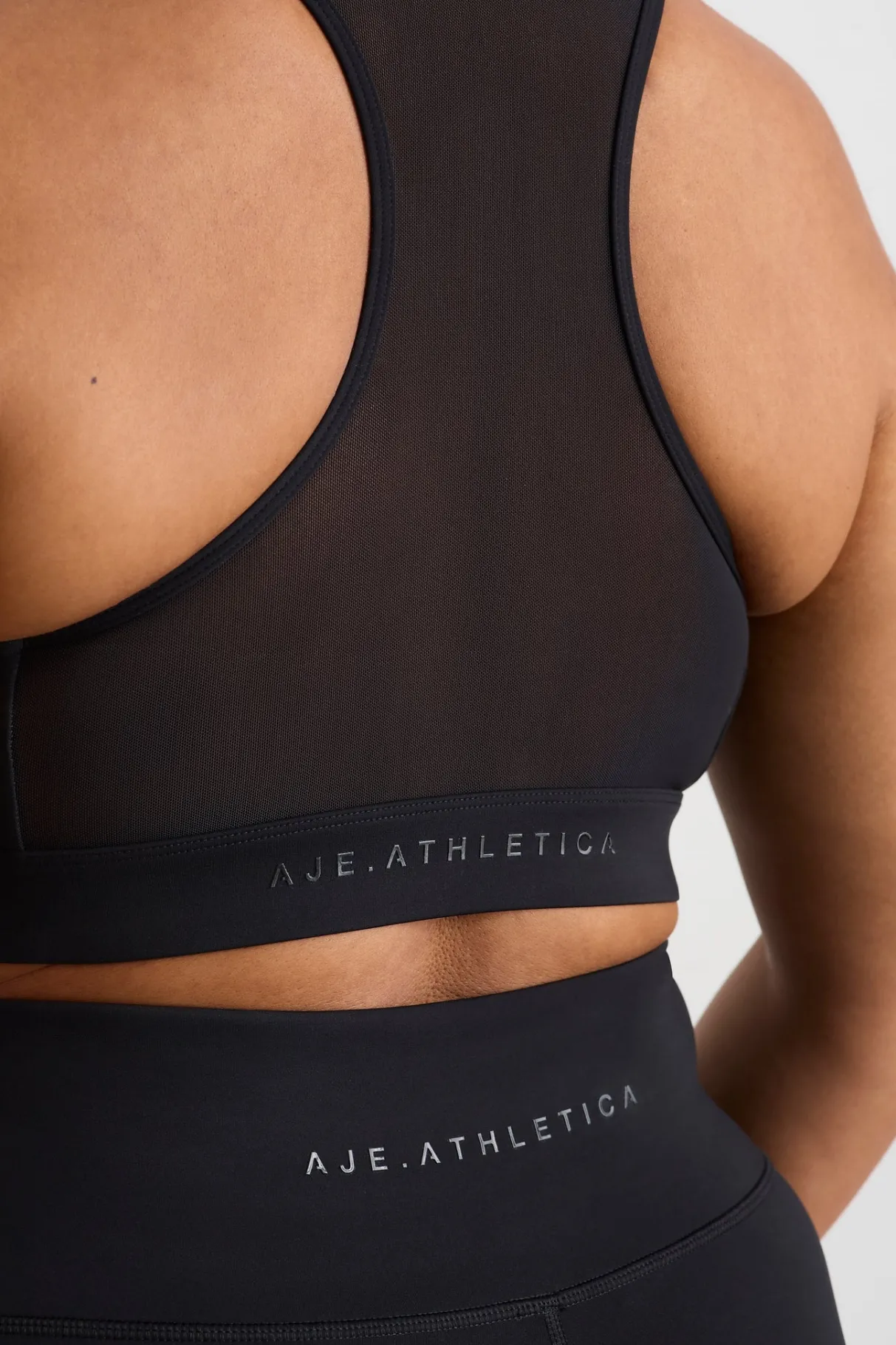 spliced_mesh_sports_bra__13.webp Discount Aje ATHLETICA Spliced Mesh Sports Bra 370 Black