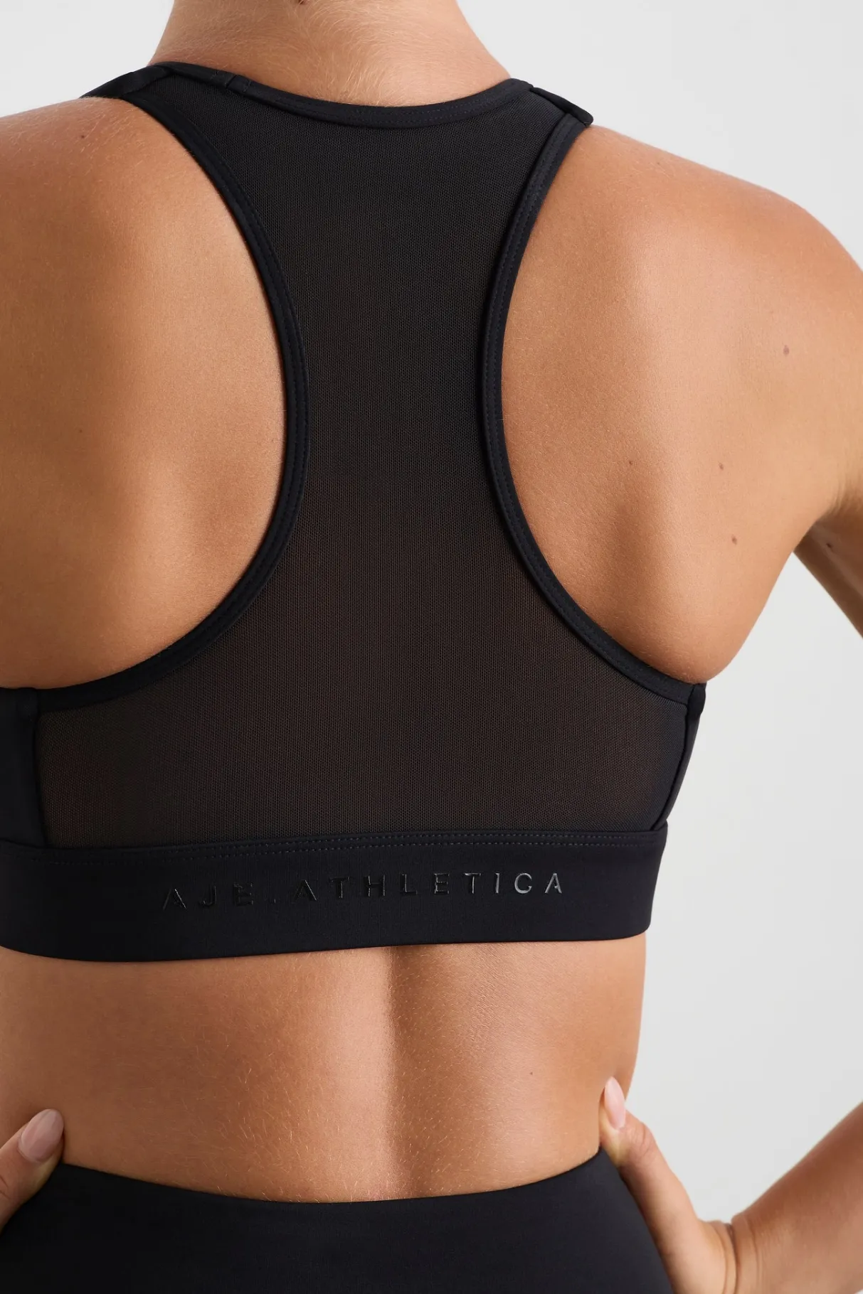 spliced_mesh_sports_bra__4.webp Discount Aje ATHLETICA Spliced Mesh Sports Bra 370 Black