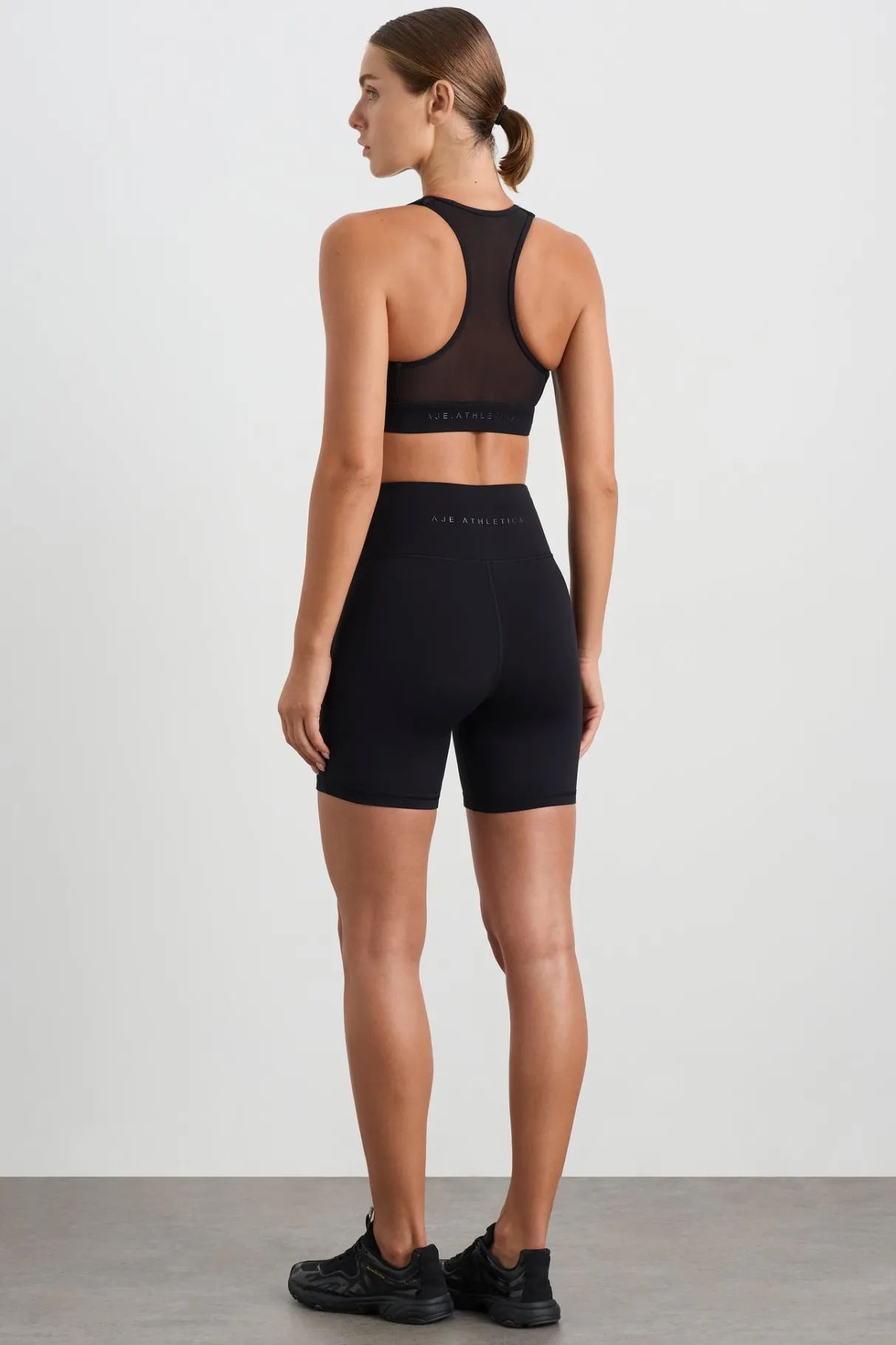 spliced_mesh_sports_bra__5.webp Discount Aje ATHLETICA Spliced Mesh Sports Bra 370 Black
