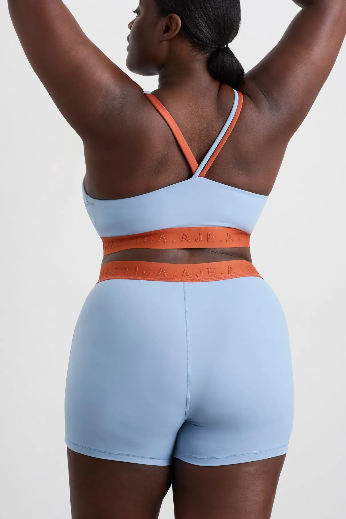 split_strap_logo_bra__15.webp Hot Aje ATHLETICA Split Strap Logo Bra 366 Steel Blue Copper Orange