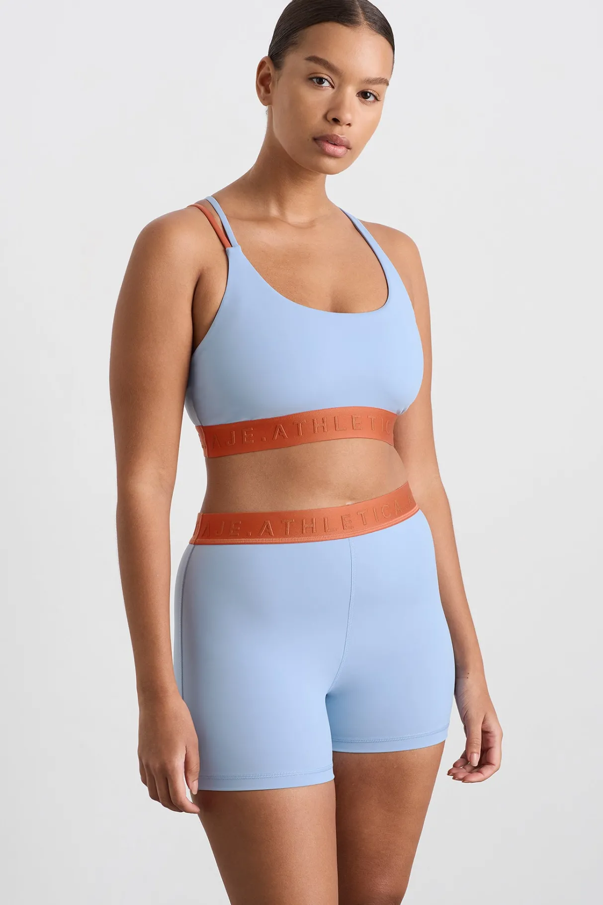split_strap_logo_bra__6.webp Hot Aje ATHLETICA Split Strap Logo Bra 366 Steel Blue Copper Orange