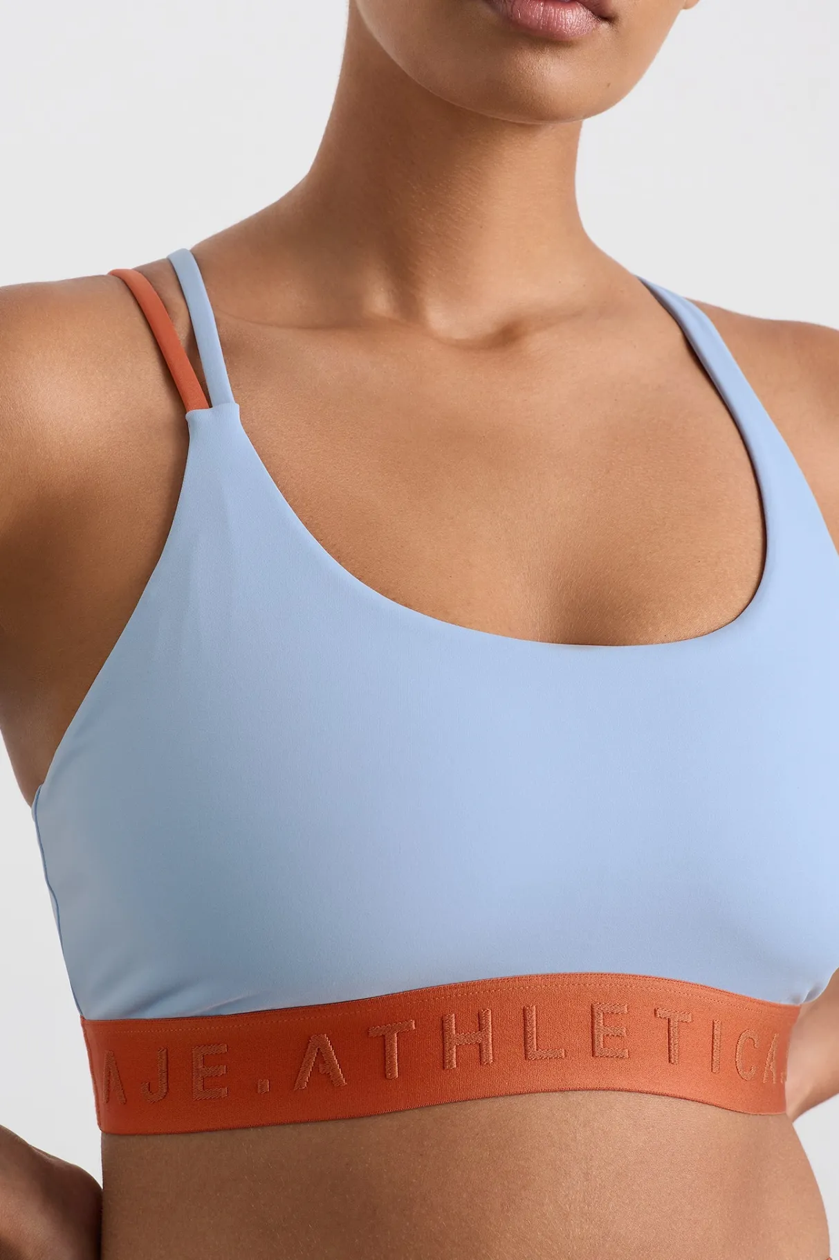 split_strap_logo_bra__8.webp Hot Aje ATHLETICA Split Strap Logo Bra 366 Steel Blue Copper Orange