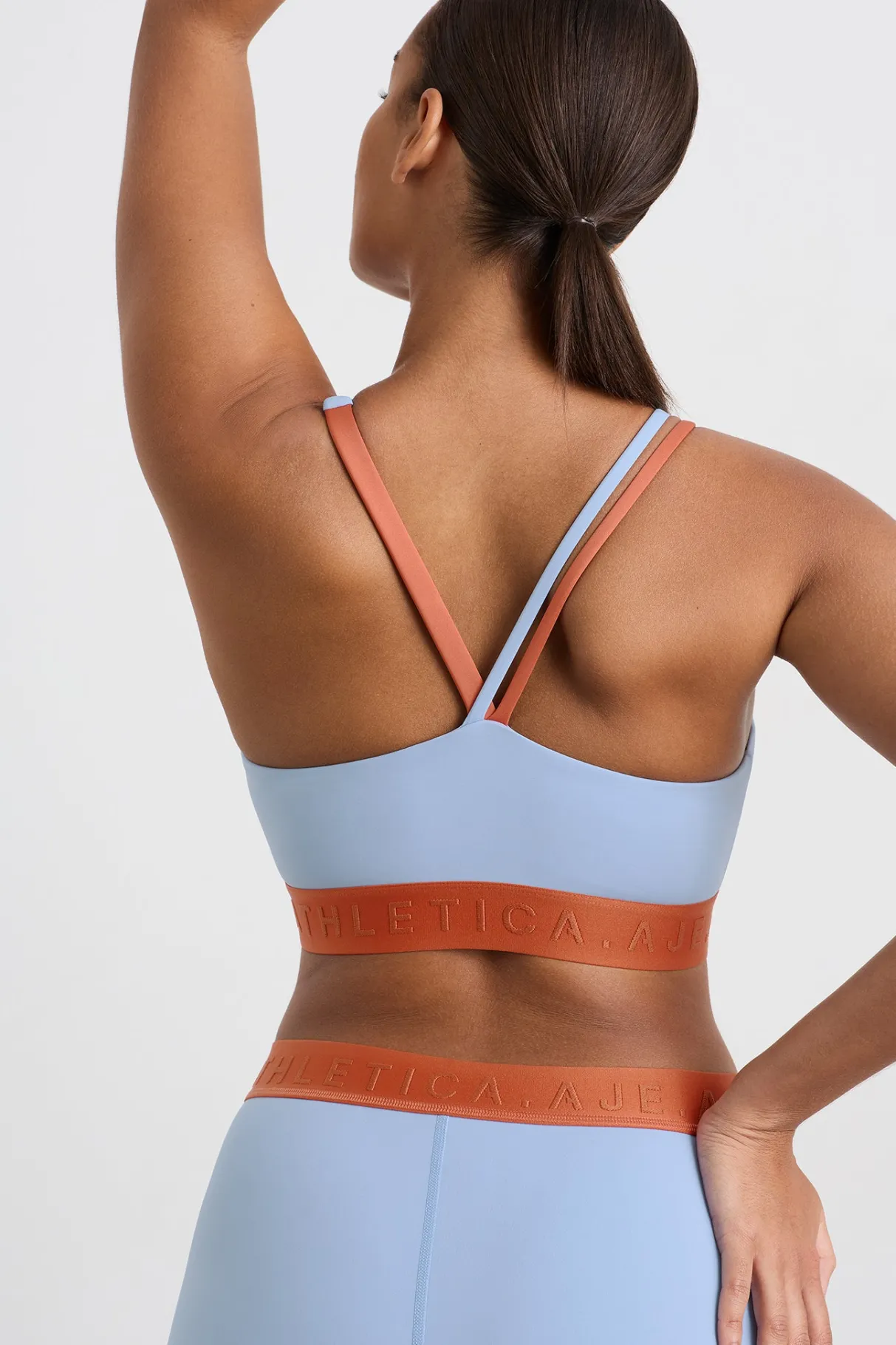 split_strap_logo_bra__9.webp Hot Aje ATHLETICA Split Strap Logo Bra 366 Steel Blue Copper Orange