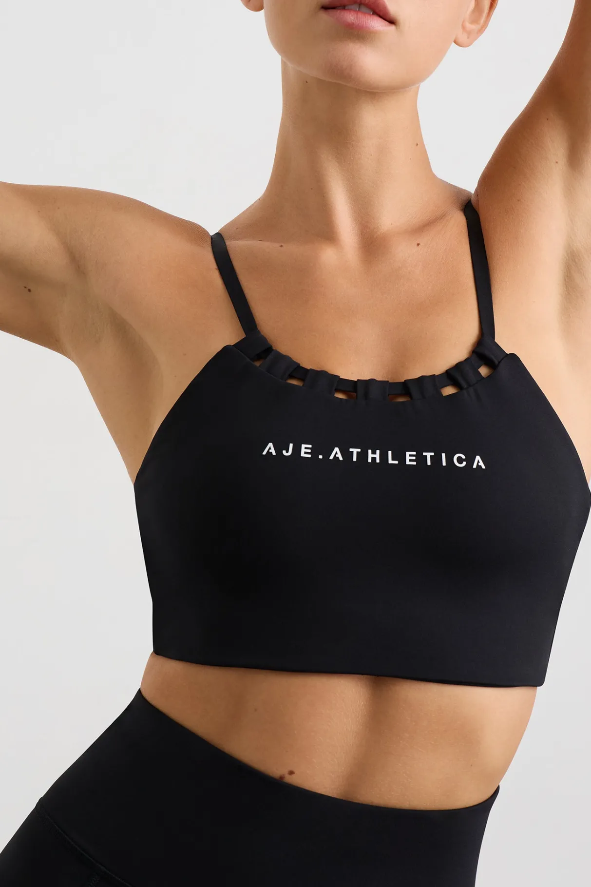 thread_through_sports_bra__0.webp Shop Aje ATHLETICA Thread Through Sports Bra 361 Black/White Logo