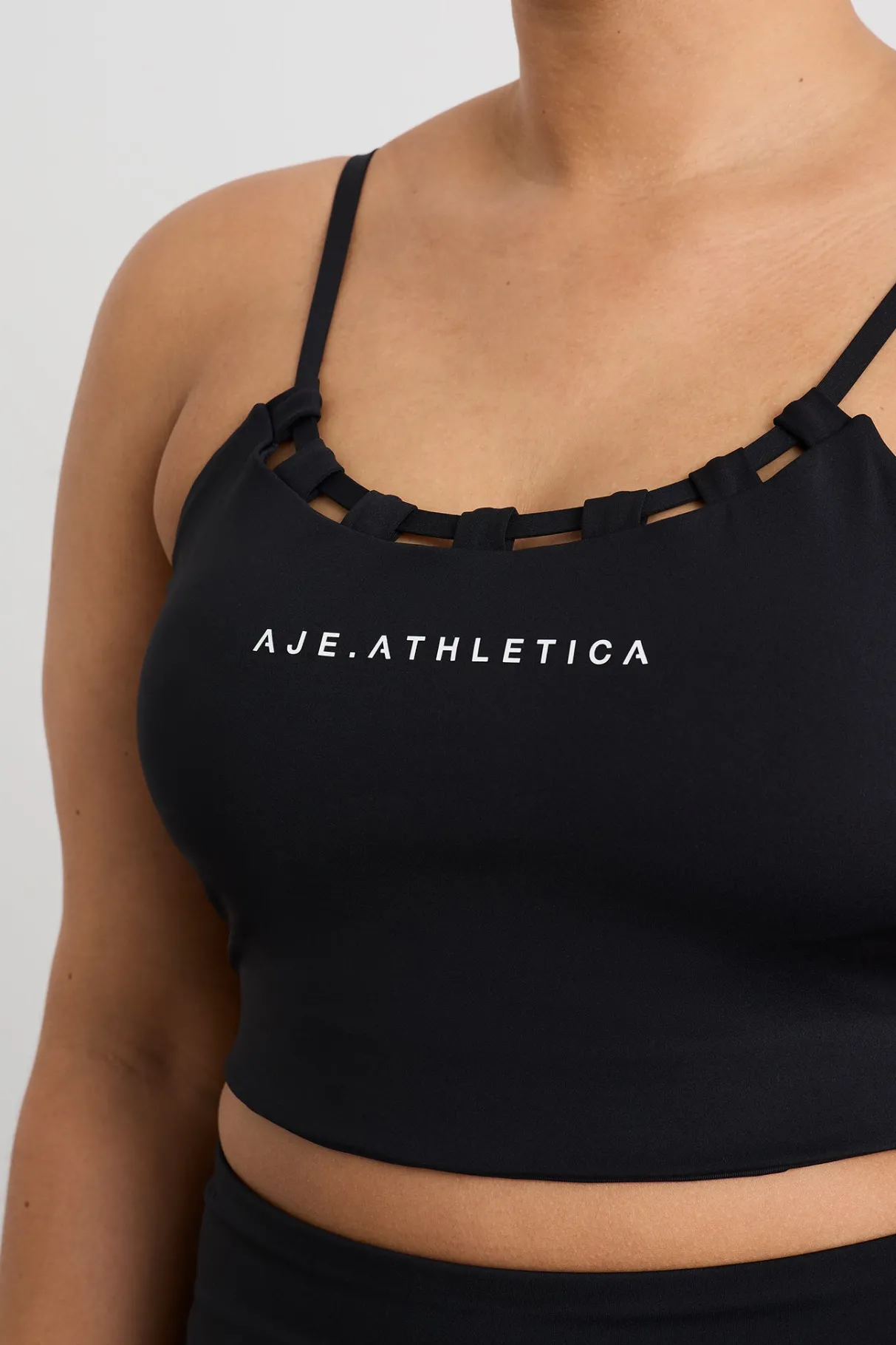 thread_through_sports_bra__13.webp Shop Aje ATHLETICA Thread Through Sports Bra 361 Black/White Logo
