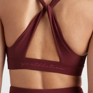Store Aje ATHLETICA Twist Back Sports Bra 335 Burnt Burgundy/Berry