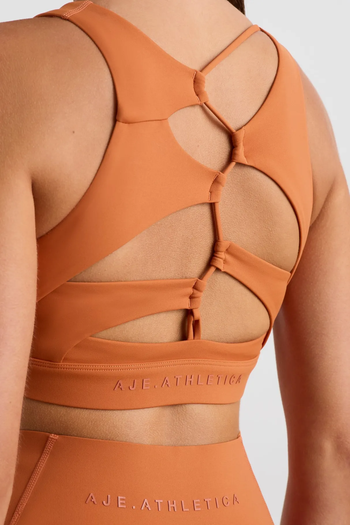 winding_road_high_neck_bra__1.webp Clearance Aje ATHLETICA Winding Road High Neck Bra 364 Copper Orange