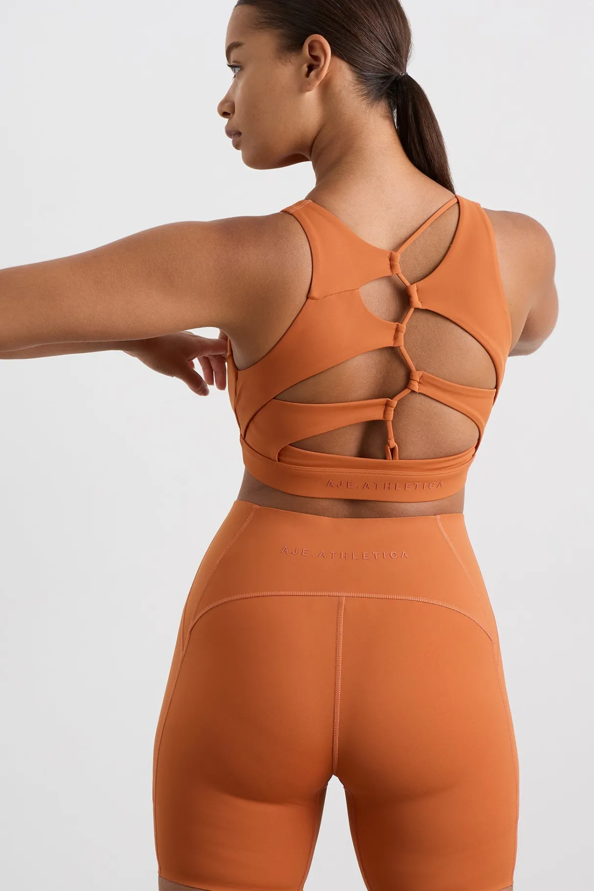 winding_road_high_neck_bra__4.webp Clearance Aje ATHLETICA Winding Road High Neck Bra 364 Copper Orange