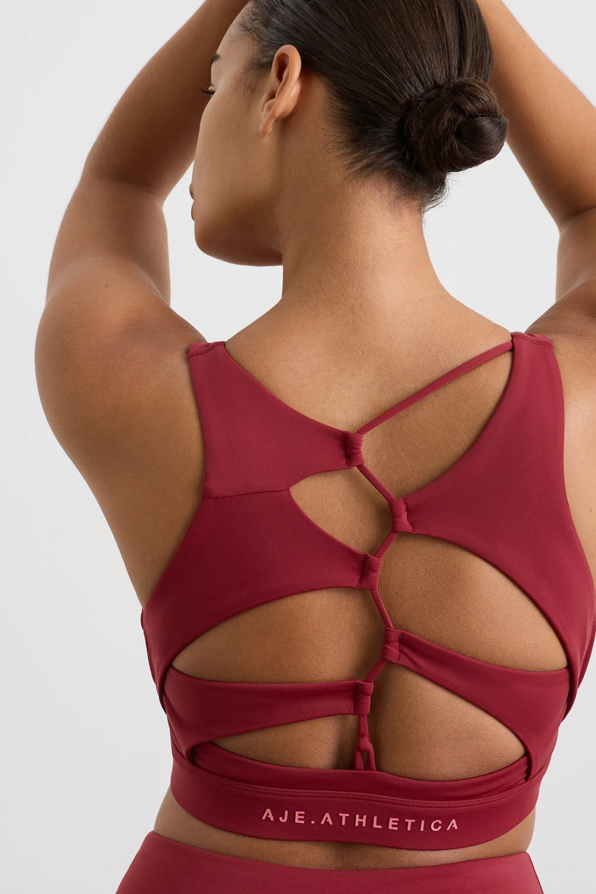 winding_road_high_neck_bra__6-1.webp Discount Aje ATHLETICA Winding Road High Neck Bra 364 Plum Red